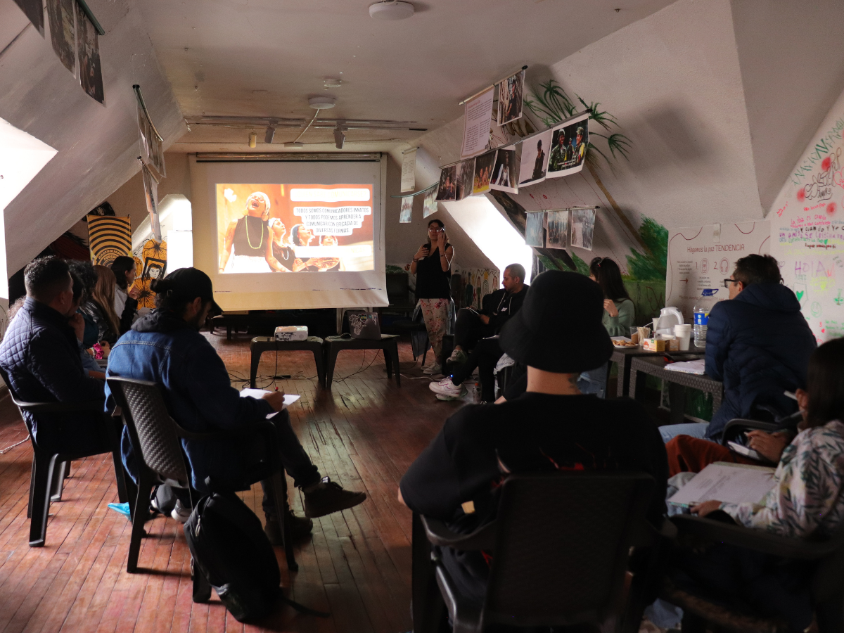 Participants involved in the project are looking at the big screen.